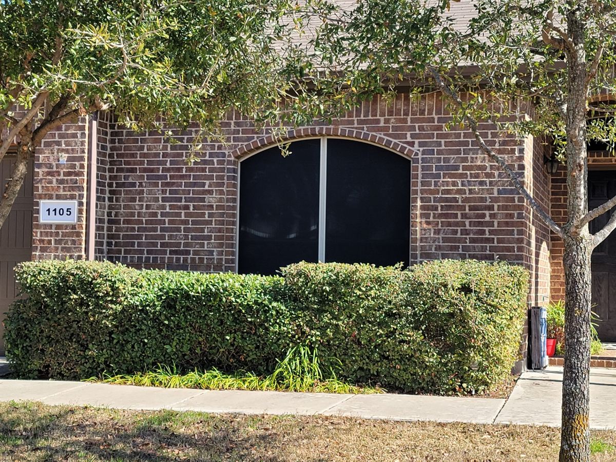Solar screen repair and replacement on brick home